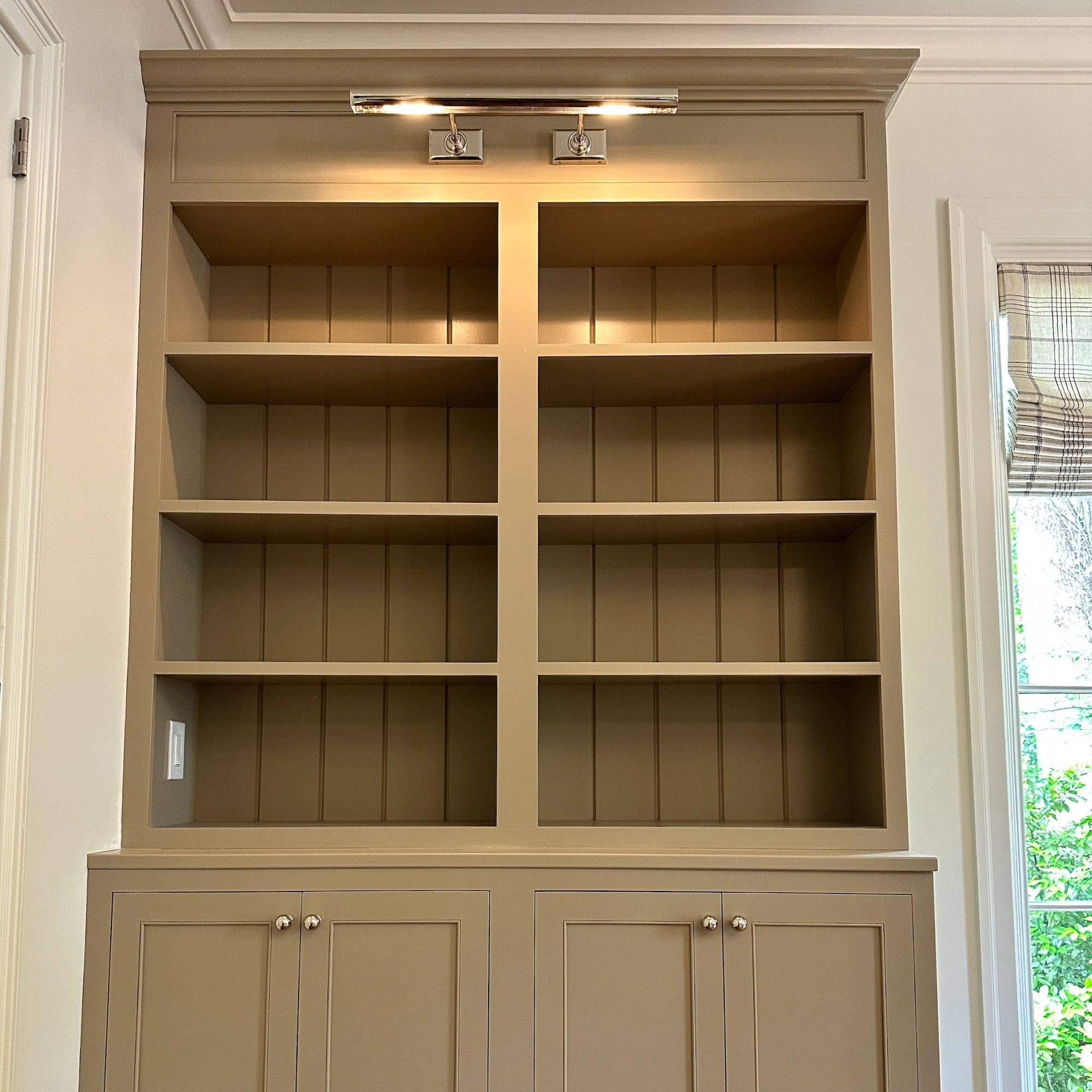 Custom built-in bookshelf in an Atlanta GA home by Reviving Dawn